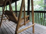 Wooden swing on the deck